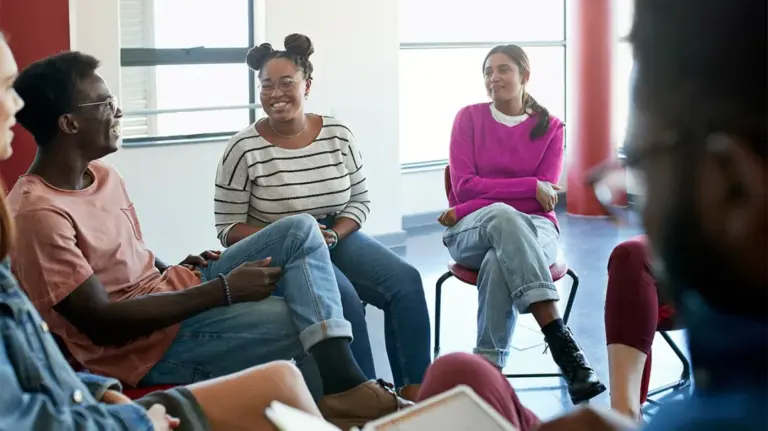 therapy-group-therapist-talking-1296x728-header